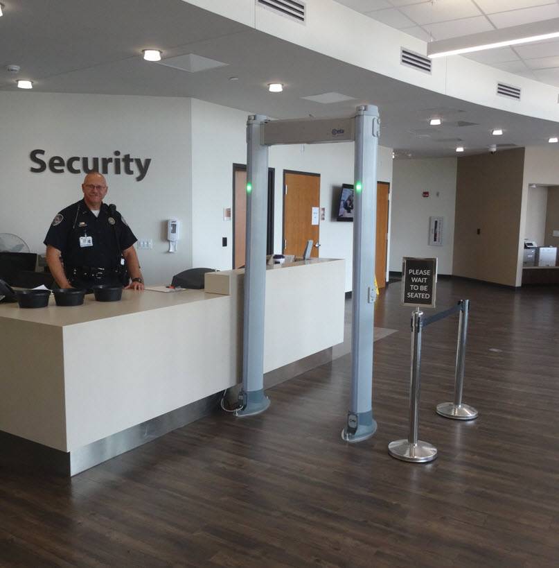 Security officer at the check-in desk of an Emergency Room department