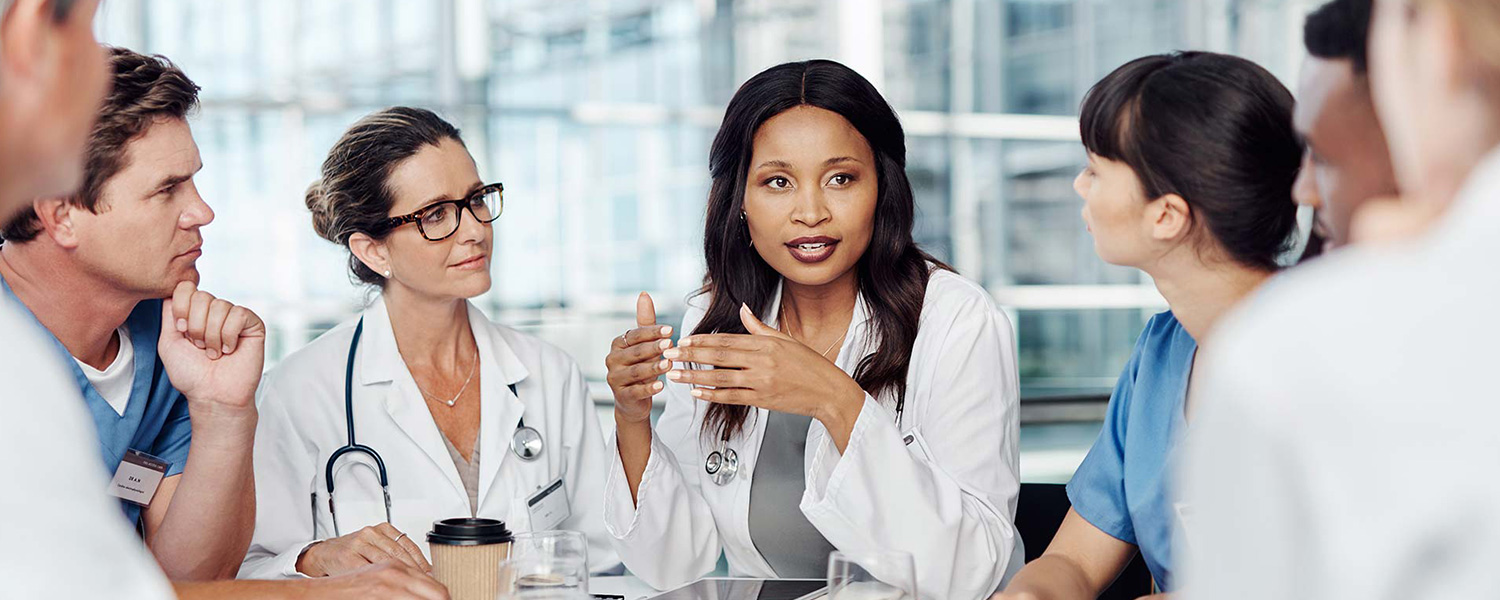 group of medical practitioners having a meeting in the boardroom