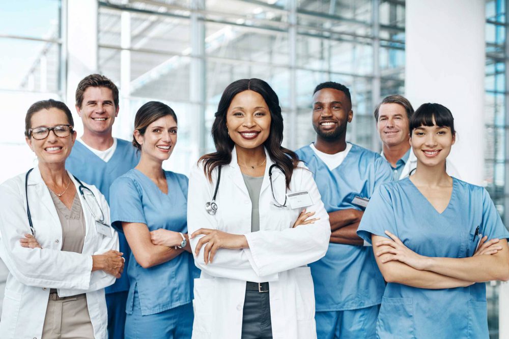 doctors and nurses lined up with arms folded