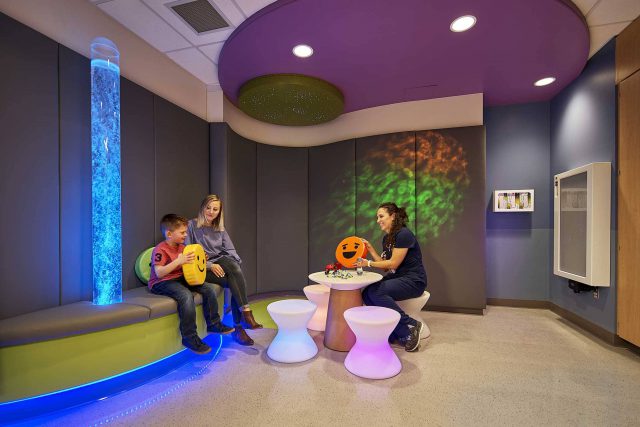 child and nurse holding emojis in Robert Wood Johnson University Hospital