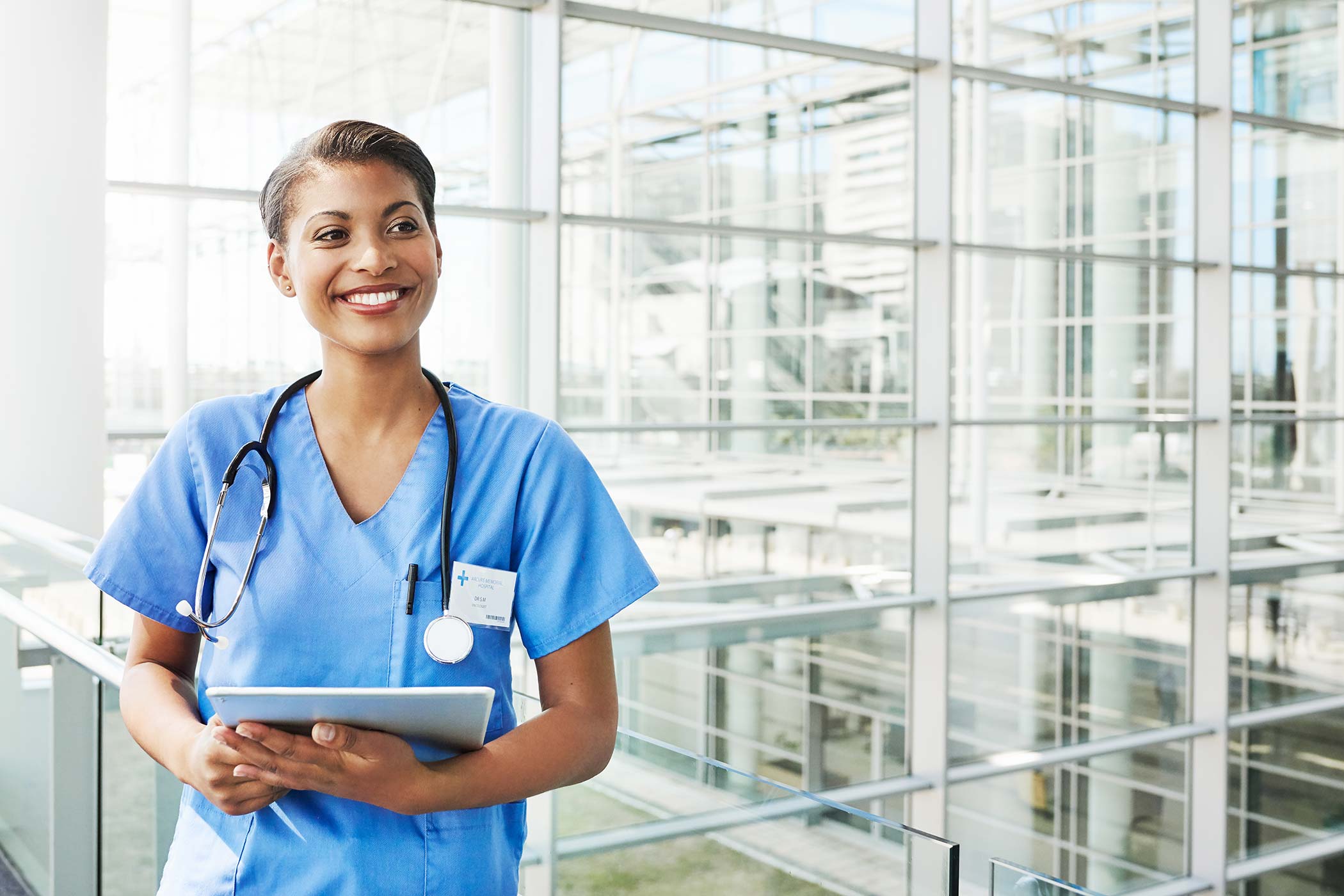 portrait of nurse in blue scrubs at hospital