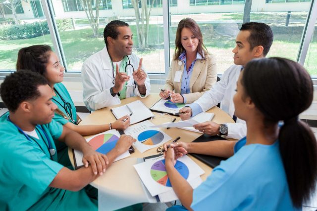 group of medical professionals review data