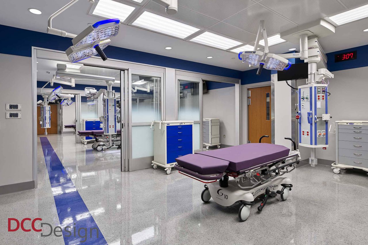 emergency room treatment area with purple bed and bright lights