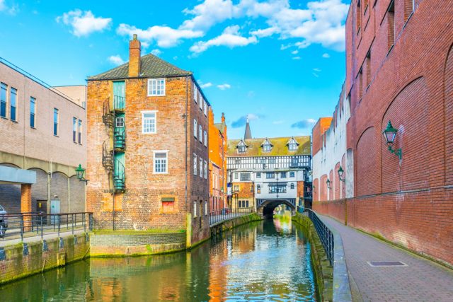 River Witham passes old wooden buildings in central Lincoln, England